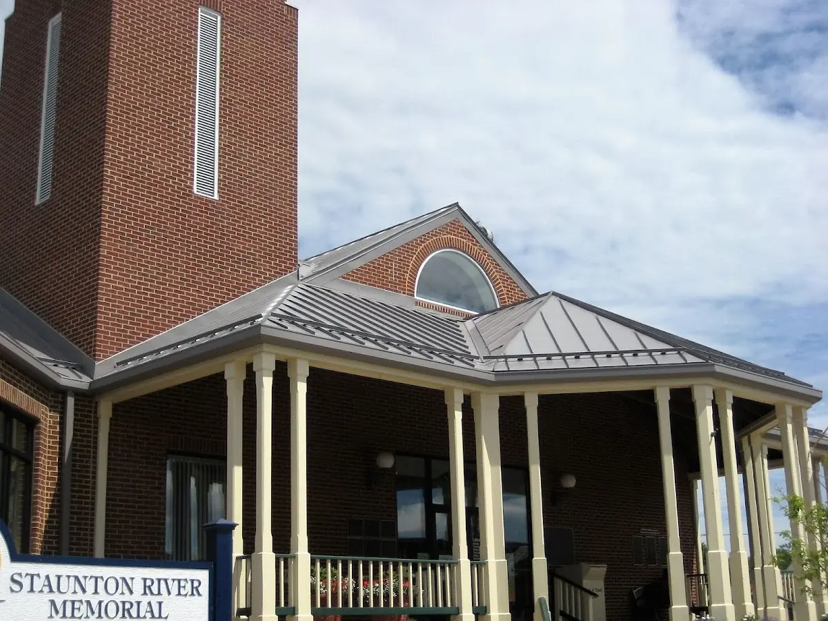 Skilled roofing craftsmen working on a residential roof in Scottsboro